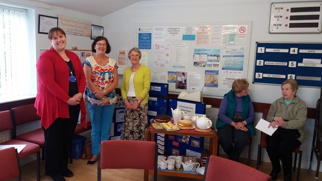 PPG members in the surgery waiting room serving hot drinks and cake